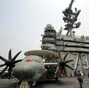 US aircraft carrier docks in HK, welcomes PLA aboard