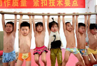 Children attend gymnastics training in summer