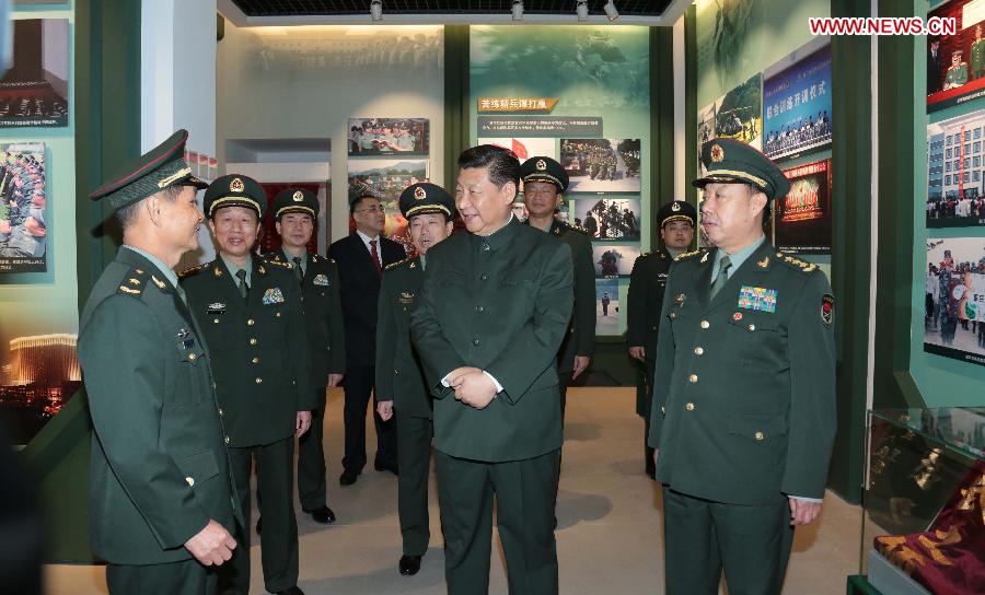 Chinese President Xi Jinping, also general secretary of the Central Committee of the Communist Party of China and chairman of the Central Military Commission, visits a history museum of the Chinese People's Liberation Army Garrison in the Macao Special Administrative Region (SAR) in Macao, south China, Dec. 20, 2014. (Xinhua/Li Gang)