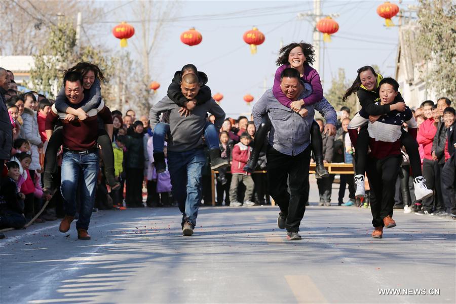 Wife-carrying contest held during celebrations in C China