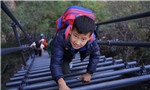 Steel stairway offers safe climb to school for cliff-top kids