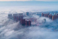 Aerial photos show fog floating above Yuncheng City in north China