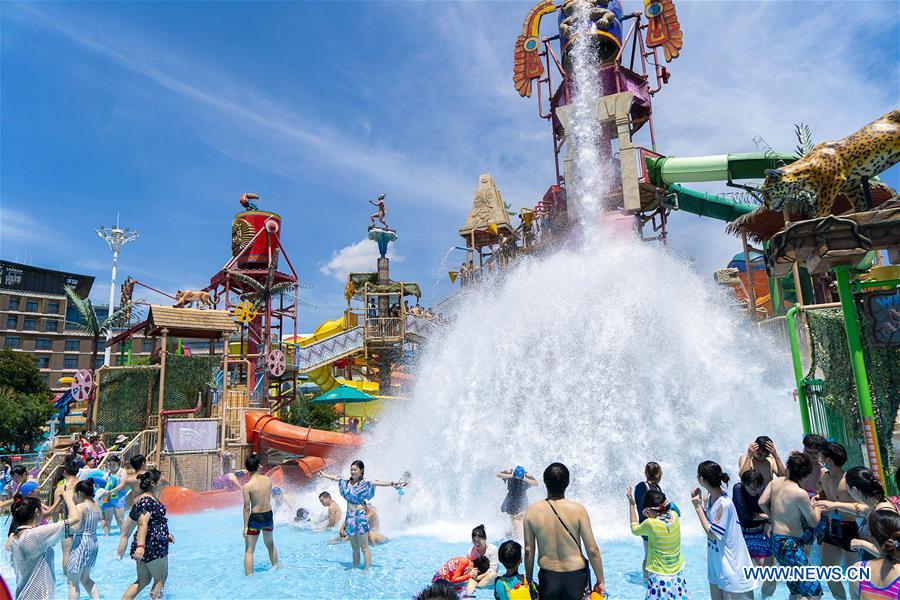 Tourists have fun at Playa Maya Water Park in Wuhan