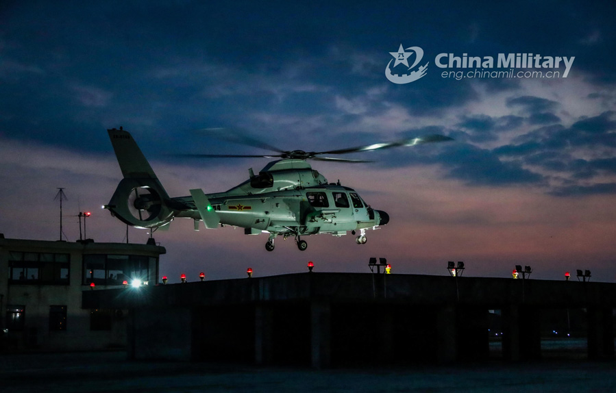 A Z-9 attack helicopter attached to a naval aviation regiment under the PLA Eastern Theater Command hovers over the parking apron during a real-combat flight training exercise in late September, 2020. (eng.chinamil.com.cn/Photo by Li Hengjiang)