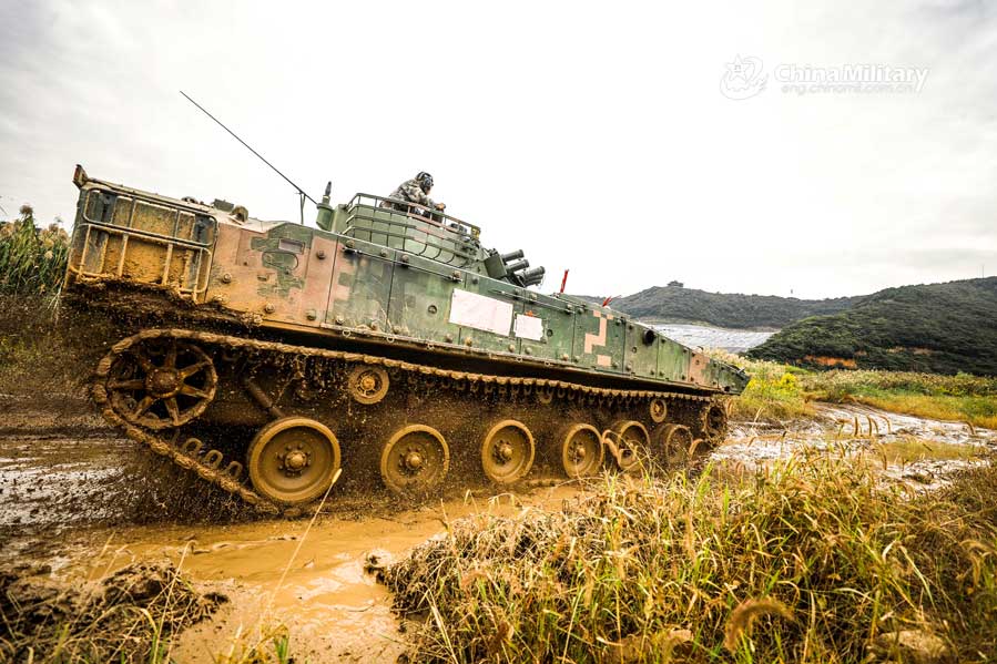 An infantry fighting vehicle attached to a brigade under the PLA 72nd Group Army rumbles through shallow dirt mire during a driving skill training exercise on October 14, 2020. (eng.chinamil.com.cn/Photo by Xiao Yuxuan)