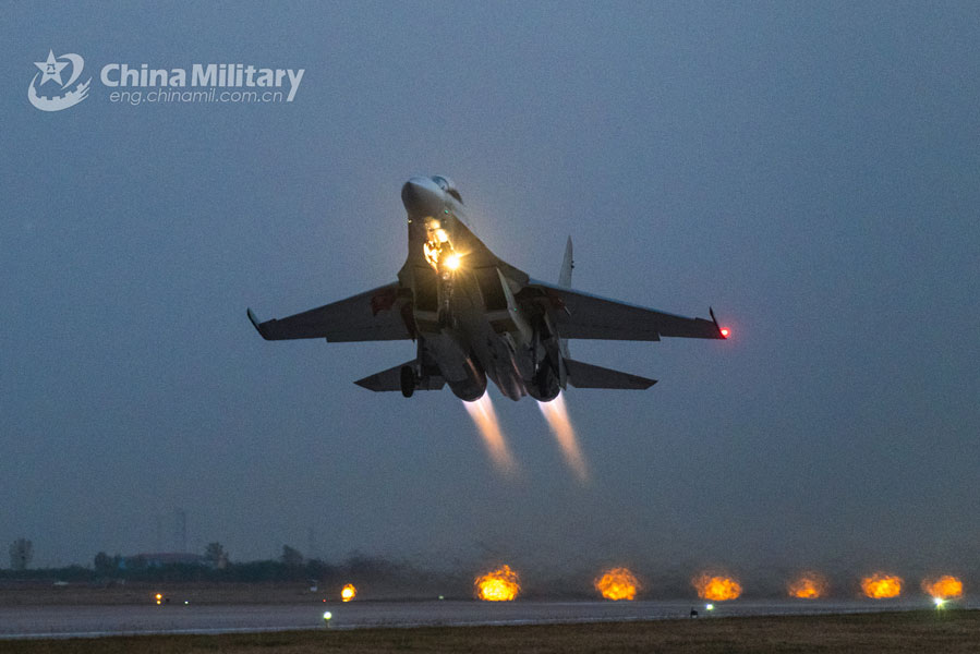 A fighter jet attached to an aviation regiment under the PLA Air Force takes off from the runway for a night patrol during a round-the-clock flight training exercise on October 21, 2020. (eng.chinamil.com.cn/Photo by Xu Chentong)