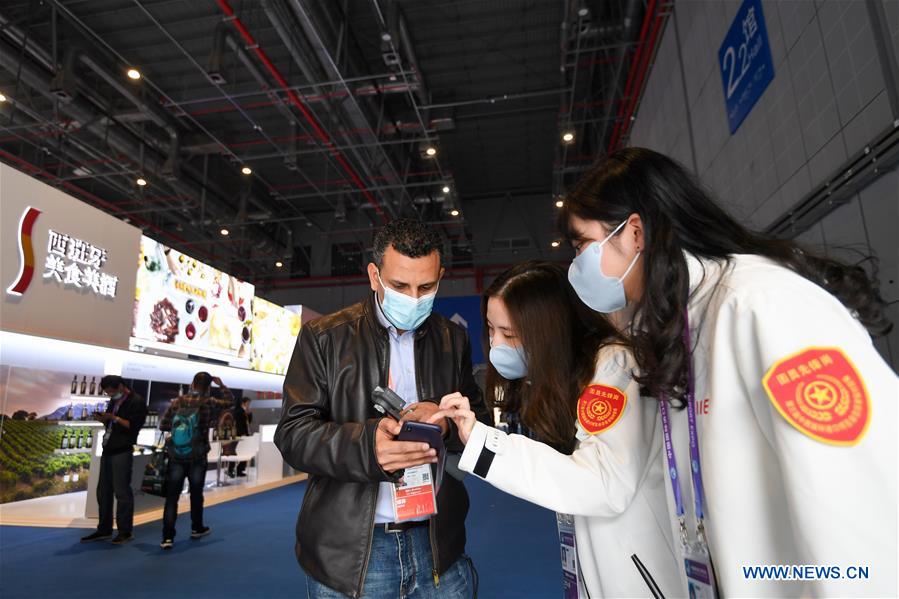 Staff members of different occupations stick to their posts during 3rd CIIE