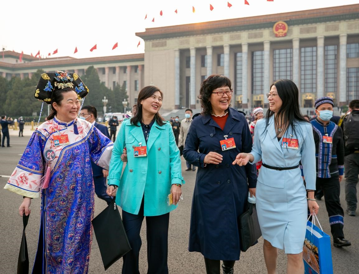 Deputies to the 13th National People’s Congress (NPC) walk out of the Great Hall of the People in Beijing after the end of the second plenary meeting of the fourth session of the 13th NPC, March 8, 2021. (People’s Daily/Zhang Wujun)