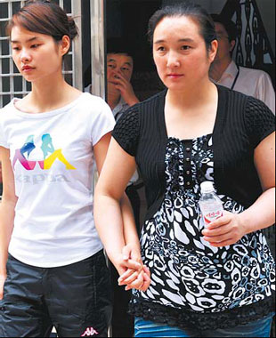 Deng Yujiao (left) and her mother Zhang Shumei walk out of the Badong ...