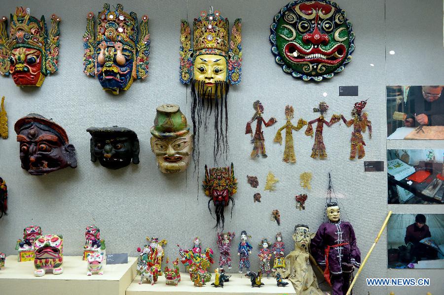 Photo taken on Nov. 7, 2012 shows puppets and masks of Nuo opera, one of the most popular folk operas in southwest China, displayed at the folk arts museum of Shandong University of Art & Design in Jinan, capital of east China's Shandong Province. (Xinhua/Guo Xulei) 
