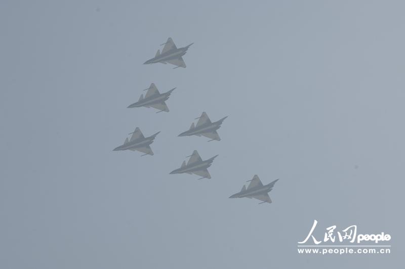 Several J-10 fighters from PLA Air Force perform at the opening ceremony of Airshow China 2012 on November 13 in Zhuhai in south China’s Guangdong province. Visitors highly praised the excellent piloting skill as well as the exceptional function of the jet fighters. (People’s Daily Online/ Yan Jiaqi)