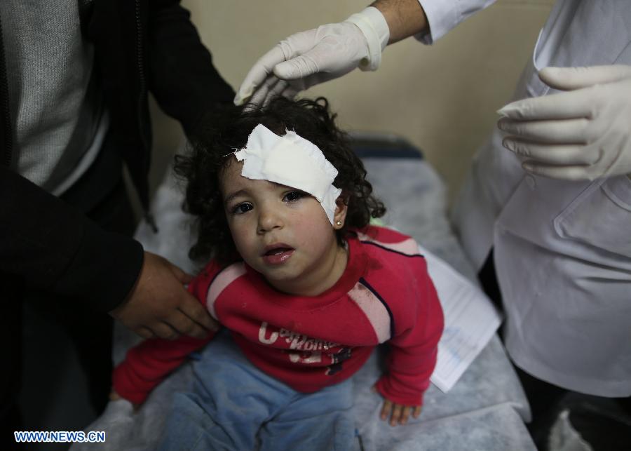 A Palestinian girl receives medical treatment at al-Shifa following an Israeli air strike in Gaza City, on Nov. 14, 2012. Israel's air force, after killing Hamas' military leader in an air raid, on Wednesday continued striking Hamas targets, including its long-range rocket sites, in the Gaza Strip. (Xinhua/Wissam Nassar)
