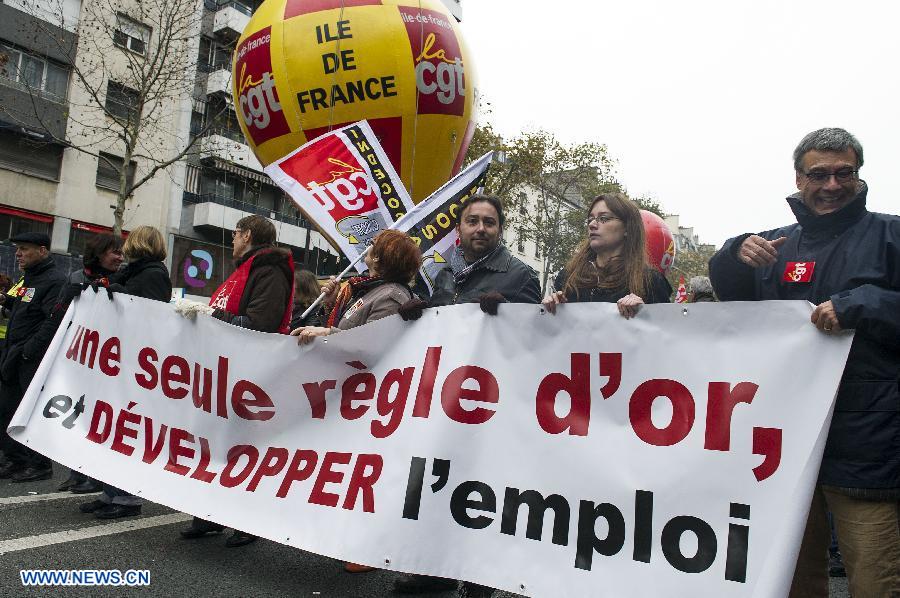 People attend a demonstration called by French trade unions, in Paris, France, Nov. 14, 2012. As part of the massive anti-austerity demonstration across Europe, thousands of French people took the streets on Wednesday to express their frustation over the austerity. (Xinhua/Etienne Laurent)