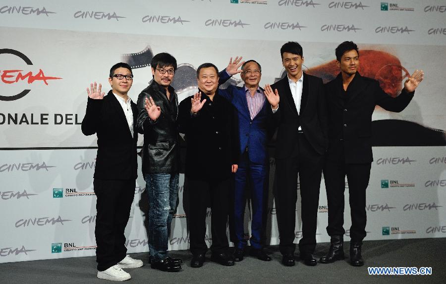 Director Johnnie To (3rd R), together with cast members and creators, poses at the photo-call of the film "Drug War" at the 7th Rome Film Festival in Rome, capital of Italy, on Nov. 15, 2012. (Xinhua/Wang Qingqin)