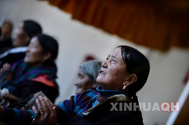 Tibetan old woman Trodam Kyi (right) is chanting in the prayer-hall in Regong Nursing Home, in Tongren County of the Huangnan Tibetan autonomous Prefecture in northwest Qinghai province on Nov. 12.