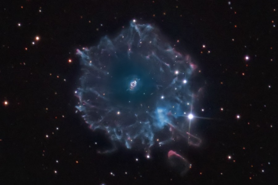 Halo of the Cat's Eye. The Cat's Eye Nebula (NGC 6543) is one of the best known planetary nebulae in the sky. Its haunting symmetries are seen in the very central region of this tantalizing image, processed to reveal the enormous but extremely faint halo of gaseous material, about 6 light-years across, which surrounds the brighter, familiar planetary nebula. (Photo/ NASA)