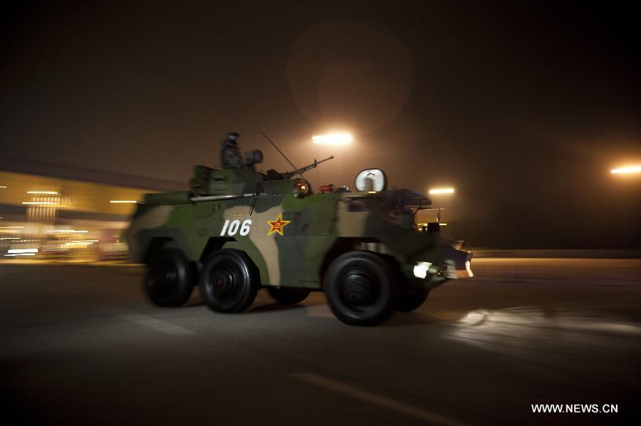 An armed vehicle of the Chinese People's Liberation Army (PLA) arrives at the Lok Ma Chau checkpoint for troop rotation in Hong Kong, south China, Nov. 25, 2012. The Chinese PLA garrison troops in the Hong Kong Special Administrative Region (HKSAR) conducted its 15th troop rotation on Sunday since it assumed Hong Kong's defense responsibility on July 1, 1997. (Xinhua/Lui Siu Wai) 
