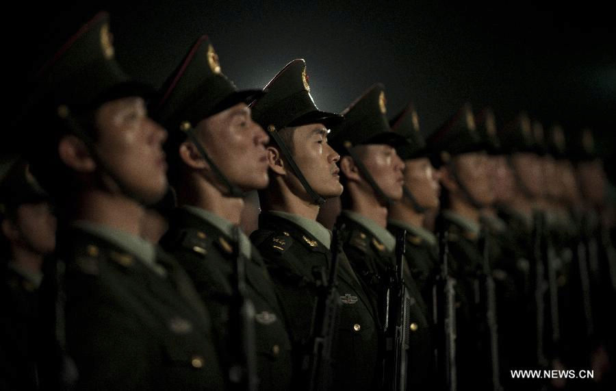 Soldiers of the Chinese People's Liberation Army (PLA) stand in their formation at a barrack during the rotation ceremony in Hong Kong, south China, Nov. 25, 2012. The Chinese PLA garrison troops in the Hong Kong Special Administrative Region (HKSAR) conducted its 15th troop rotation on Sunday since it assumed Hong Kong's defense responsibility on July 1, 1997. (Xinhua/Lui Siu Wai) 