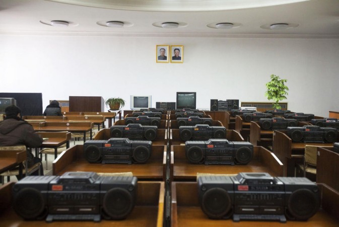 Rows of portable stereos are placed on the desktop in a music room in the Pyongyang People's Learning auditorium.(Photo/Xinhua)