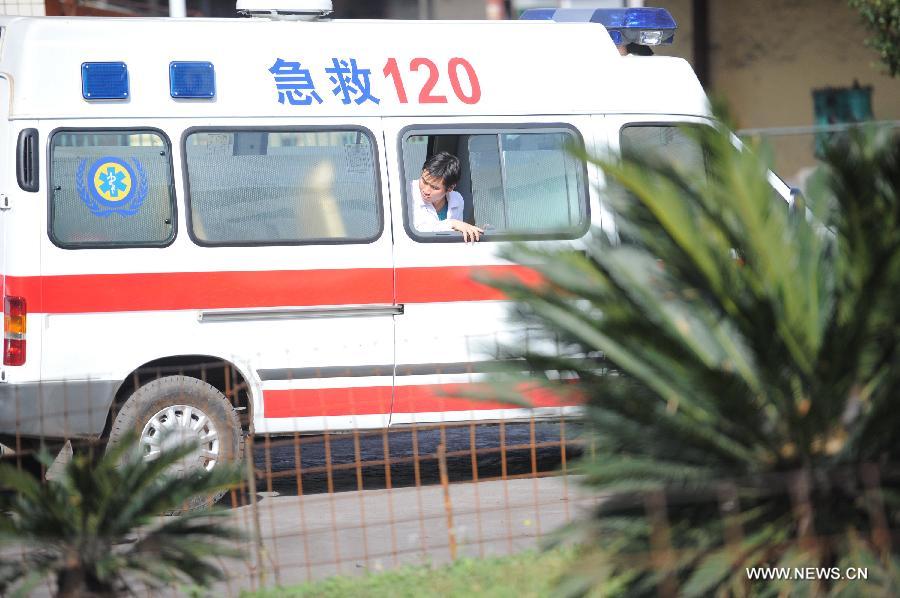 An ambulance waits at the entrance of the Xiangshui Coal Mine in Panxian County of Liupanshui City, southwest China's Guizhou Province, Nov. 25, 2012. Nineteen miners were confirmed dead, and four others remain trapped after a coal-gas outburst hit the Xiangshui Coal Mine at 10:55 a.m. on Saturday.(Xinhua/Tao Liang) 