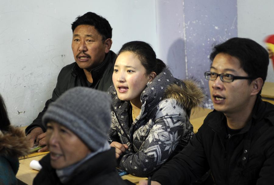 Students attend a Tibetan language course at Dhungker Language School in Lhasa, capital of southwest China's Tibet Autonomous Region, Nov. 22, 2012. (Xinhua/Chogo)