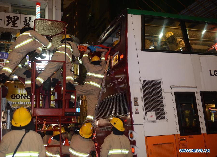 Rescuers work at a bus collision scene in Wan Chai, south China's Hong Kong, Nov. 27, 2012. At least 40 people were injured in a traffic accident involving three buses in Hong Kong on Tuesday evening, local authorities said. (Xinhua/Liu Yongdong) 