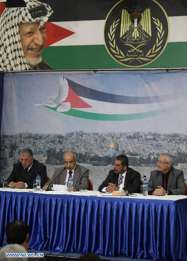 The Palestinian committee to probe the circumstances of Arafat's death holds a press conference in the West Bank City of Ramallah on Nov. 27, 2012. Earlier Tuesday, the Palestinian National Authority (PNA) finalized digging up the remains of Arafat, as Russian, Swiss and French experts took samples of the remains to inspect the reason behind his death. (Xinhua/Ayman Nobani)