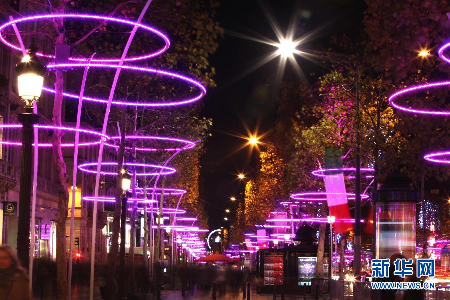 The Champs Elysees is decorated by illuminations in Paris, capital of France, on Nov. 21, 2012, which marks opening of Christmas Season in Paris. (Xinhua/Gao Jing)