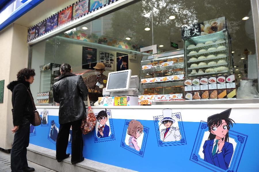Customers do shopping at Detective-Conan-themed Lawson convenience store in Shanghai, east China, Nov.28, 2012. The store which was designed and constructed according to the scene of the Japanese cartoon Detective Conan, opened to the public in Shanghai on Wednesday. (Xinhua/Lai Xinlin) 