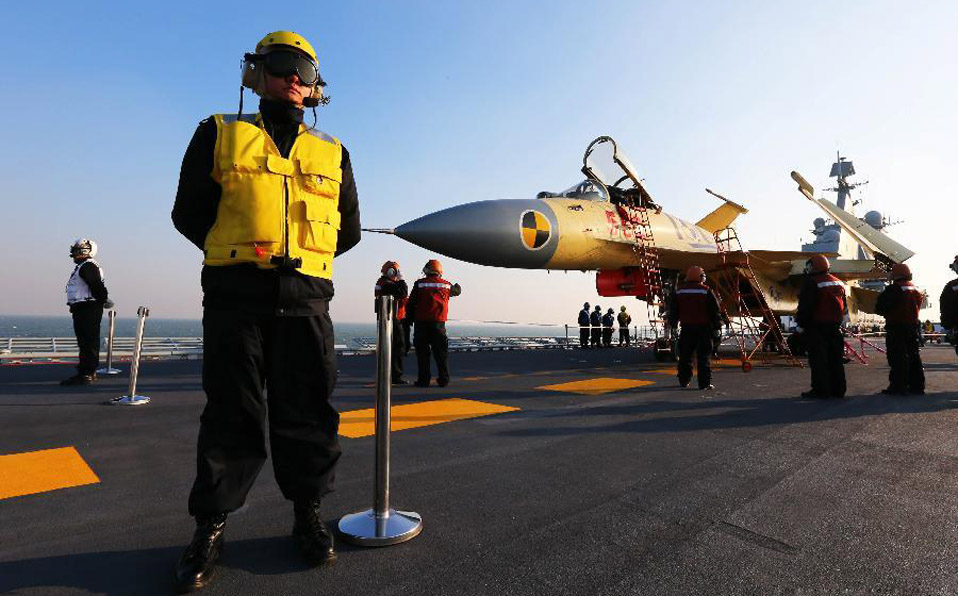 China conducts flight landing on first aircraft carrier 