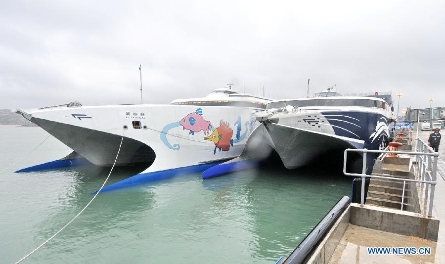 Two passenger liners across the Taiwan Strait named Haixia (R) and Jiayuan (L) are anchored at a port in Pingtan County, southeast China's Fujian Province, Nov. 30, 2012. 