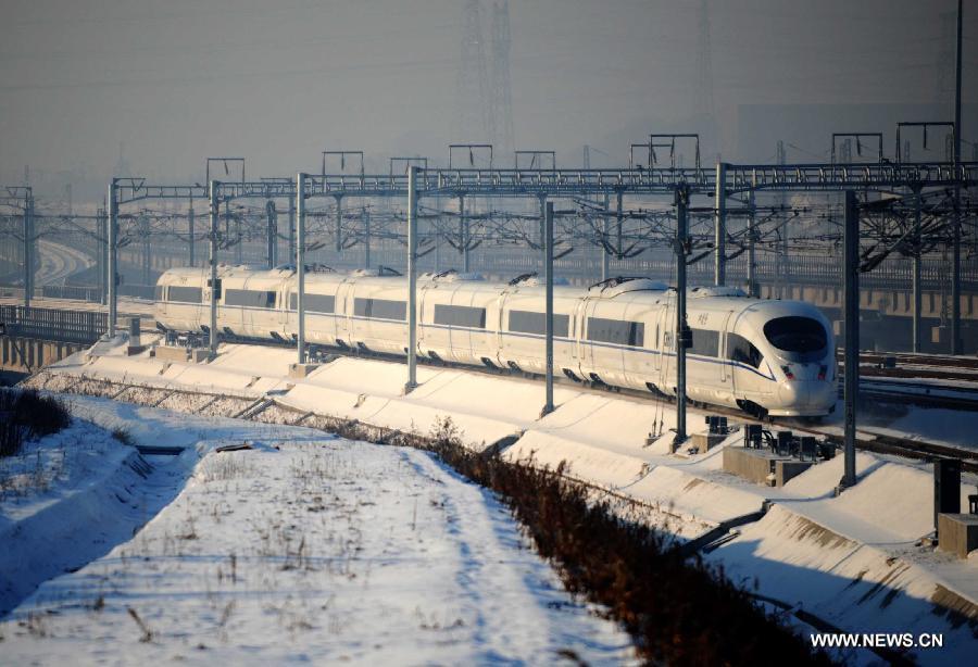 A high-speed train leaves the Harbin West Railway Station in Harbin, capital of northeast China's Heilongjiang Province, Dec. 1, 2012. The world's first high-speed railway in areas with extremely low temperatures, namely the Hada High-speed Railway which runs through the three provinces in northeast China, started operation on Saturday. The railway links Harbin, capital of Heilongjiang Province, and Dalian, a port city in Liaoning Province. (Xinhua/Wang Jianwei)