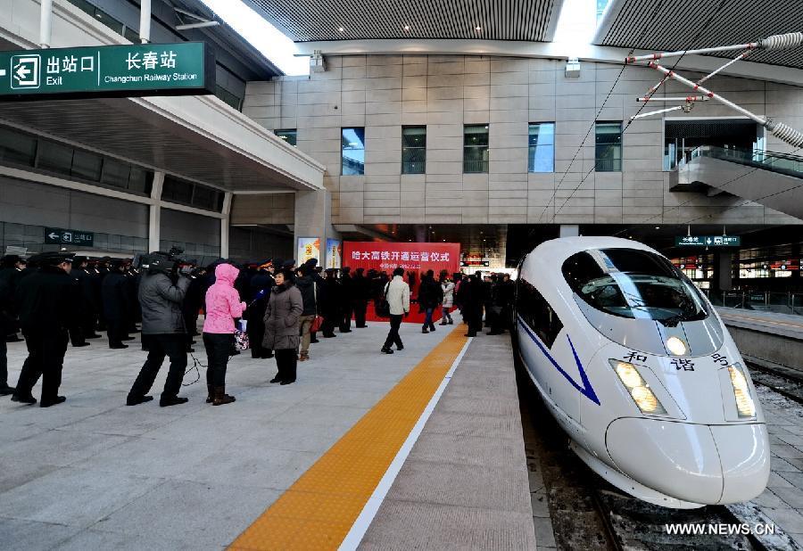 A high-speed train is seen at the Changchun Railway Station in Changchun, capital of northeast China's Jilin Province, Dec. 1, 2012. The world's first high-speed railway in areas with extremely low temperature, which runs through three provinces in northeastern China, started operation on Saturday. The railway links Harbin, capital of Heilongjiang Province, and Dalian, a port city in Liaoning Province. (Xinhua/Zhang Nan)