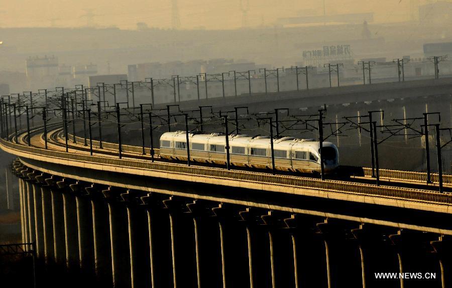 Photo taken on Dec. 1, 2012 shows a high-speed train from Dalian North Railway Station to Harbin West Railway Station. The world's first high-speed railway in areas with extremely low temperature, which runs through Liaoning, Jilin and Heilongjiang provinces in northeastern China, started operation on Saturday. The railway links Harbin, capital of Heilongjiang , and Dalian, a port city in Liaoning. (Xinhua/Lv Wenzheng)