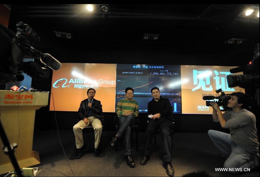 Zhang Yong (1st, L), president of online retail website Tmall.com, a platform under the world's largest e-commerce group Alibaba, answers questions during a media briefing in Hangzhou, capital of east China's Zhejiang Province, Dec. 3, 2012. During a media briefing on Monday, the Alibaba Group, which owns Tmall.com and its consumer-to-consumer (C2C) counterpart Taobao.com, announced that the transaction volume of the two platforms has reached one trillion RMB (about 161 billion U.S. dollars) by the end of November 2012, ranking after east China's Guangdong, Shandong, Jiangsu and Zhejiang Province in terms of social consumption goods retail volume as compared to the number of 2011.(Xinhua/Huang Zongzhi)