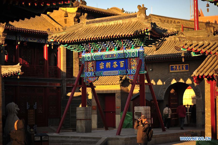 Tourists visit the Tianhou Temple in north China's Tianjin Municipality, Dec. 3, 2012. The Tianhou Temple completed its repair work and was opened to society on Monday. (Xinhua/Wang Xiaoming) 