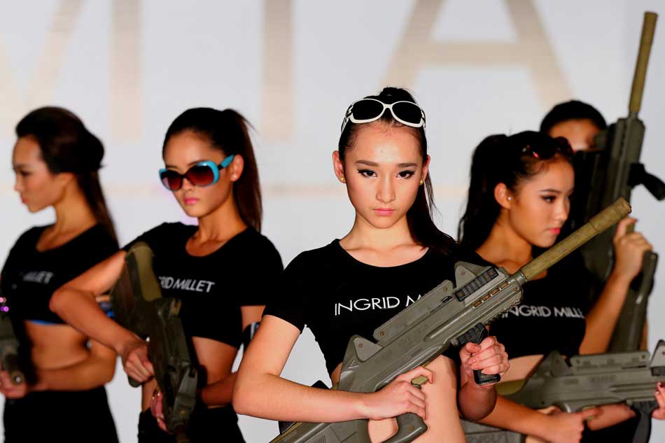 Contestants perform at the 2012 China USA Super Model Contest China Final held in Beijing on Dec. 12, 2012. (Xinhua/Gong Bing)