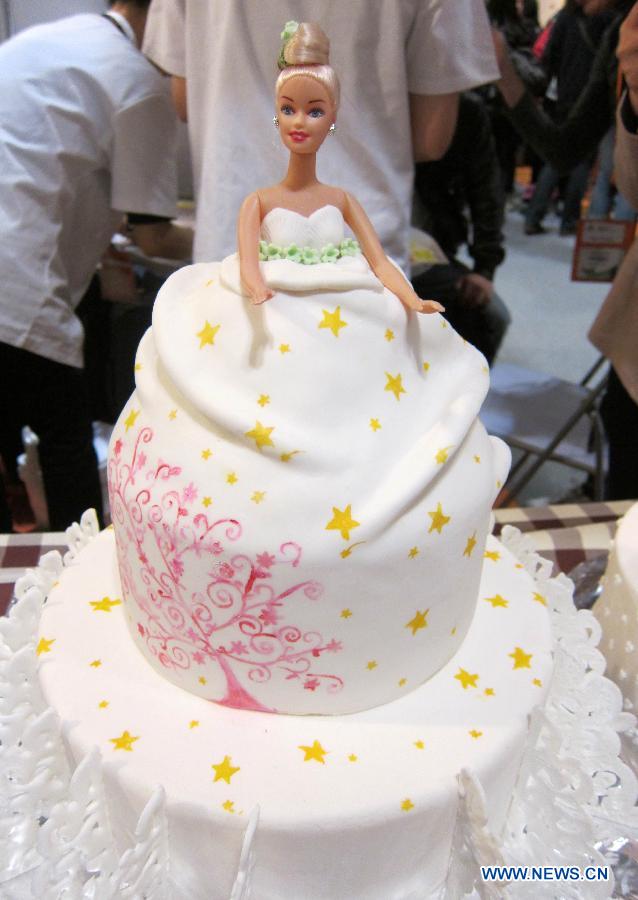 A model of Barbie-doll-shaped cake is exhibited at the Hong Kong International Bakery Expo in Hong Kong, south China, Dec. 5, 2012. The three-day bakery event kicked off here Wednesday, involving participants from home and abroad. (Xinhua/Zhao Yusi)