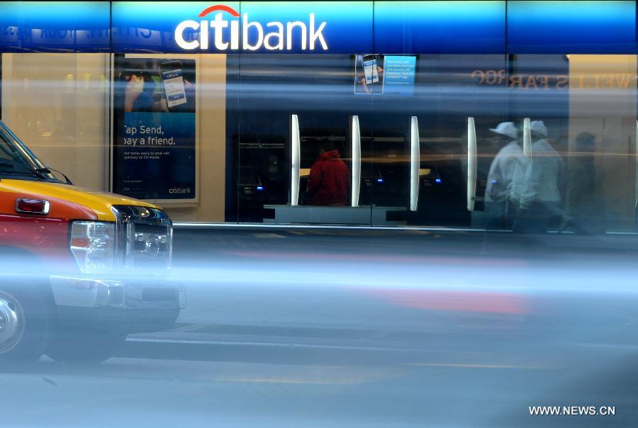 A Citibank branch is seen in New York, the United States, Dec. 5, 2012. Citigroup announced on Wednesday that it would slash 11,000 jobs, or roughly 4 percent of its current workforce, in an effort to cut costs. (Xinhua/Wang Lei)