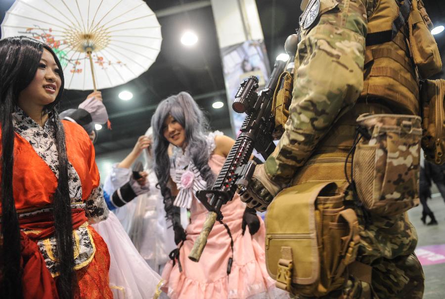 Cosplayers talk with each other during the 1st Cosplay Cultural Festival in Hangzhou, capital of east China's Zhejiang Province, Dec. 9, 2012. The two-day festival closed on Sunday. (Xinhua/Han Chuanhao)