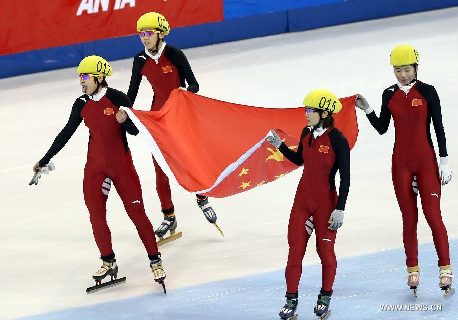 The players of China celebrate victory after winning the women's 3000m relay final during the ISU Short Track World Cup speed skating competition in Shanghai, China, on Dec. 9, 2012. China claimed the title with a time of 4 minutes 7.660 seconds. (Xinhua/Fan Jun)