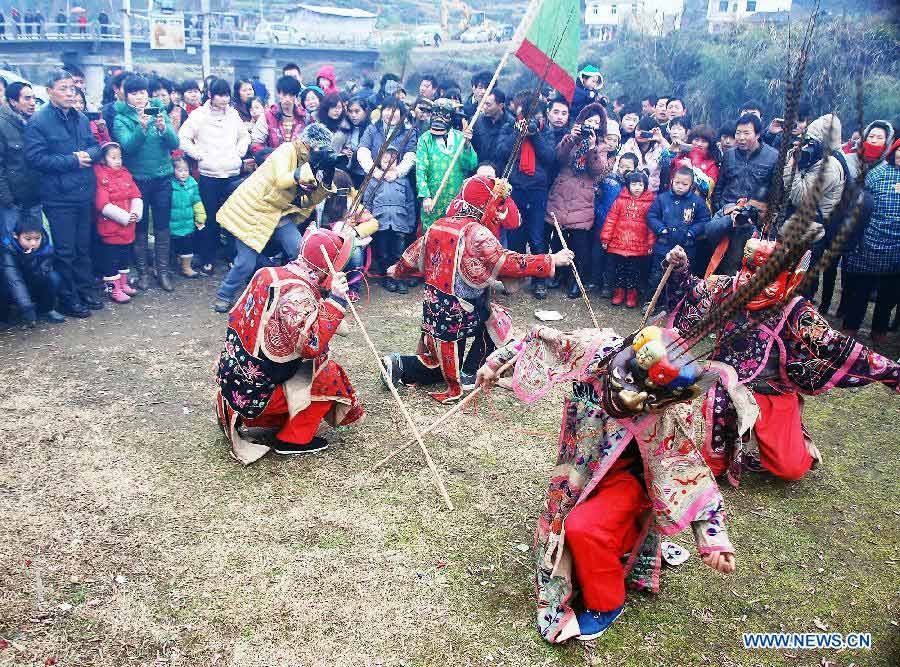 File photo taken on Jan. 24, 2012 shows Nuo dance artists giving performance in Changjing Village of Wuyuan County, east China's Jiangxi Province. (Xinhua/Zhang Weiguo)