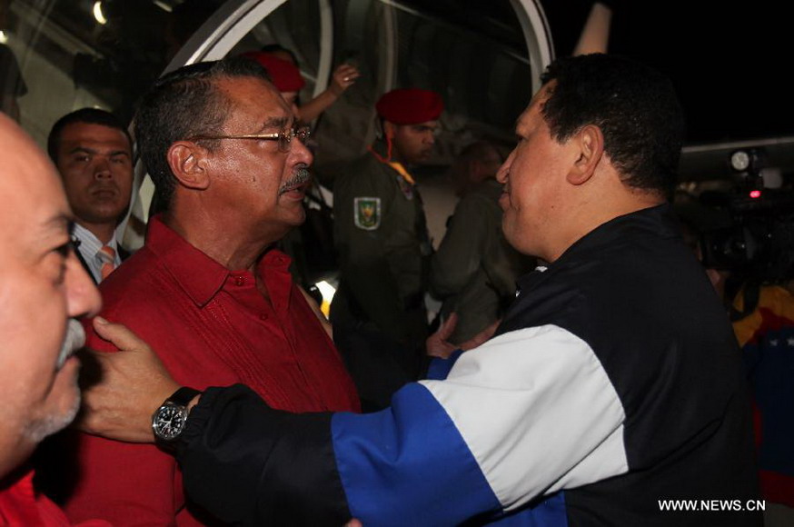 Venezuelan President Hugo Chavez (R) is seen before leaving for Cuba at the Simon Bolivar International Airport in Maiquetia, Venezuela, Dec. 10, 2012. President Hugo Chavez returned to Cuba early Monday for emergency surgery. (Xinhua/Venezuelan Presidency) 