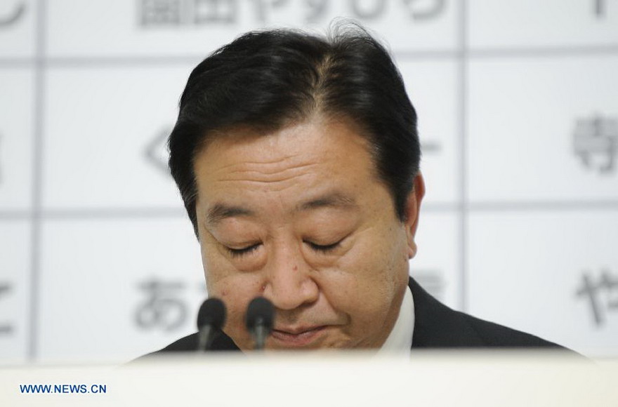 Japan's Prime Minister Yoshihiko Noda, leader of Japan's Democratical Party of Japan (DPJ), pauses during a news conference at his party's election headquarters in Tokyo, Dec. 16, 2012. Yoshihiko Noda, said on late Sunday that he quits from the party's presidency.(Xinhua/Kenichiro Seki)