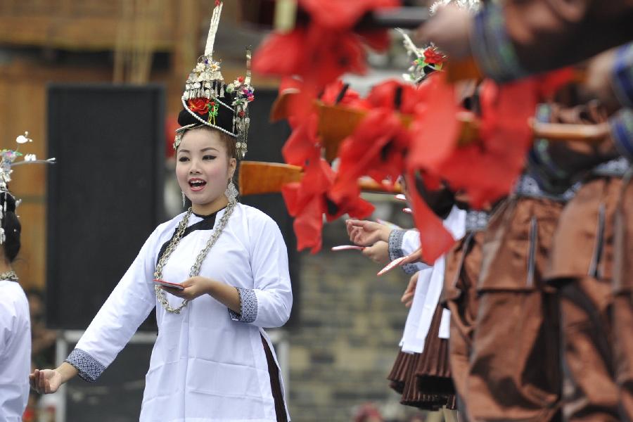 A woman from Dong ethnic group sings in the opening ceremony of the Sama Festival in Rongjiang County, southwest China's Guizhou Province, Dec. 18, 2012. The Sama Festival, an ancient traditional festival commemorating the woman ancestors of Dong ethnic group, was listed as one of China's state intangible cultural heritages in 2006. The festival of this year will last till Dec. 20. (Xinhua/Ou Dongqu) 