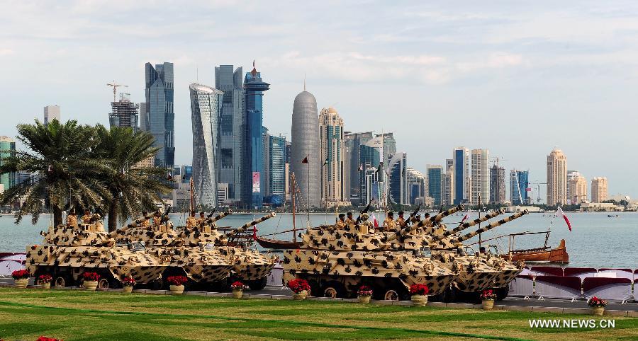 Armored vehicles take part in a military parade during Qatar's National Day in Doha, Qatar, on Dec. 18, 2012. (Xinhua/Chen Shaojin) 