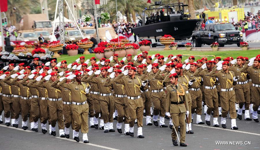 Soldiers take part in a military parade during Qatar's National Day in Doha, Qatar, on Dec. 18, 2012. (Xinhua/Chen Shaojin)  
