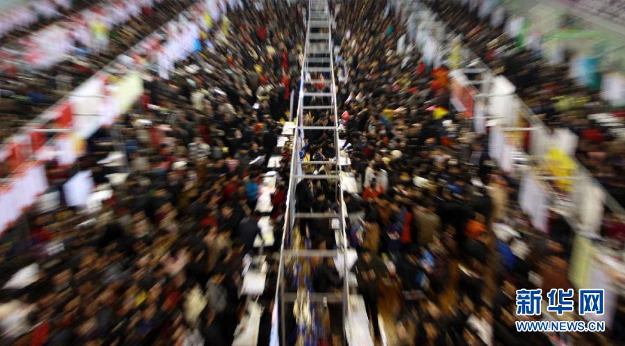 The second spring recruitment fair is held in Yinchuan City Stadium on Feb. 11, 2012, attracting nearly 10,000 job seekers. (Xinhua/Zhang Tong)