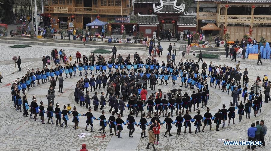 People of the Dong ethnic group take part in an ancestor-worshipping ritual during the Sama Festival in Rongjiang County, southwest China's Guizhou Province, Dec. 19, 2012. As a part of the ongoing celebration of the Sama Festival, an ancient traditional festival commemorating the woman ancestor, a ritual was held on Wednesday to worship a heroine ancestor of the group named Sama. The festival will last untill Dec. 20. (Xinhua/Ou Dongqu)