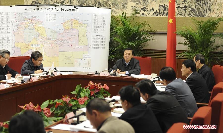 File photo taken on Feb. 26, 2011 shows Zhang Dejiang (C) holds a meeting to organize the evacuation of Chinese nationals in Libya and ensure their safety. (Xinhua/Xie Huanchi) 